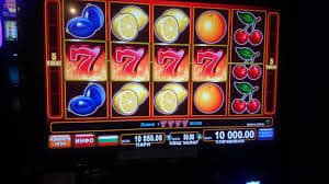 Live casino gaming screen with live dealer and chat interface